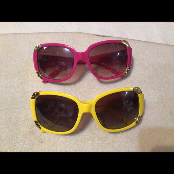 2 pairs of yellow and hot pink sun glasses. - Picture 1 of 9